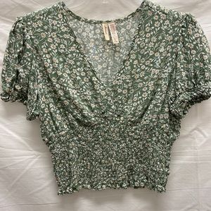Marisol sage green smocked top with floral print.
